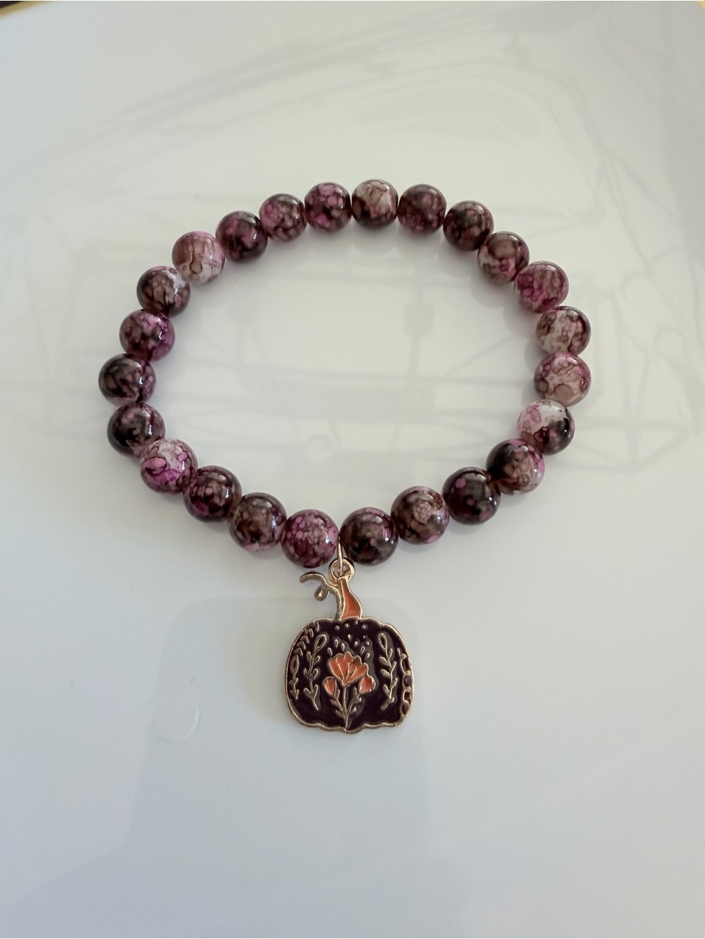 Purple Marbled Bead Bracelet with Pumpkin Flower Charm